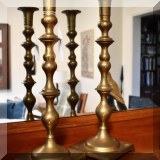 D23. Pair of brass candlesticks. 15”h - $18 